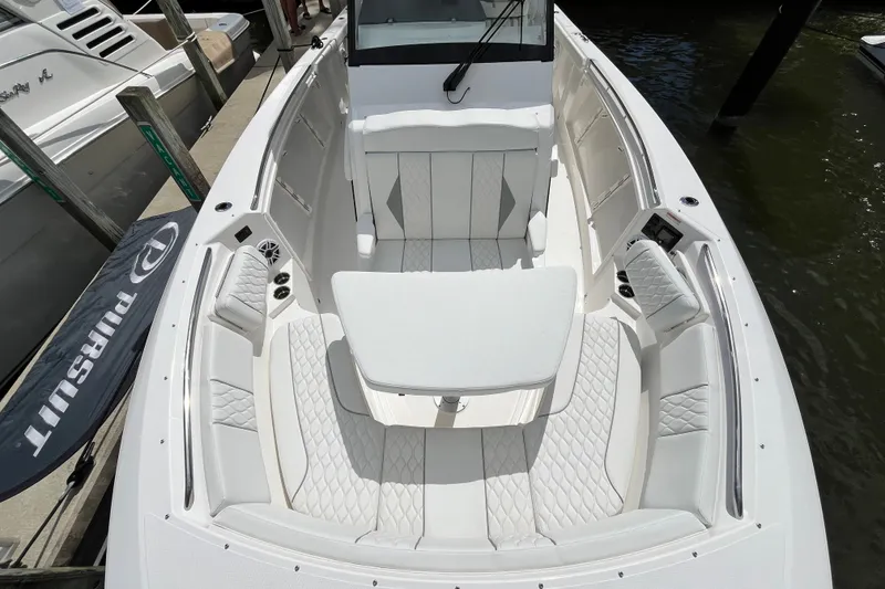 Slide: The Image of Luxurious 2027 Pursuit S 358 Sport boat interior with elegant seating and table. - 9