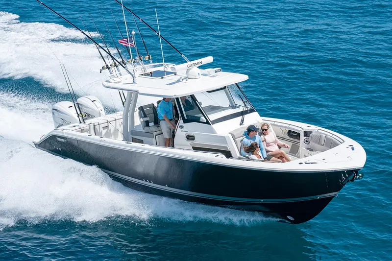 Slide: The Image of Manufacturer Provided Image: 2025 Pursuit S 358 Sport boat cruising on open water with passengers. - 1