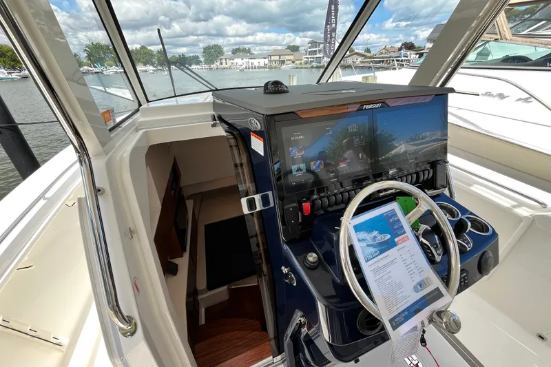 Slide: The Image of 2027 Pursuit S 358 Sport boat helm with advanced navigation system and luxurious interior. - 12