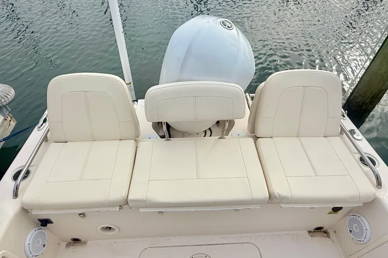 Slide: The Image of 2021 Grady-White 251 Coastal Explorer boat with cushioned seating and Yamaha engine. - 12