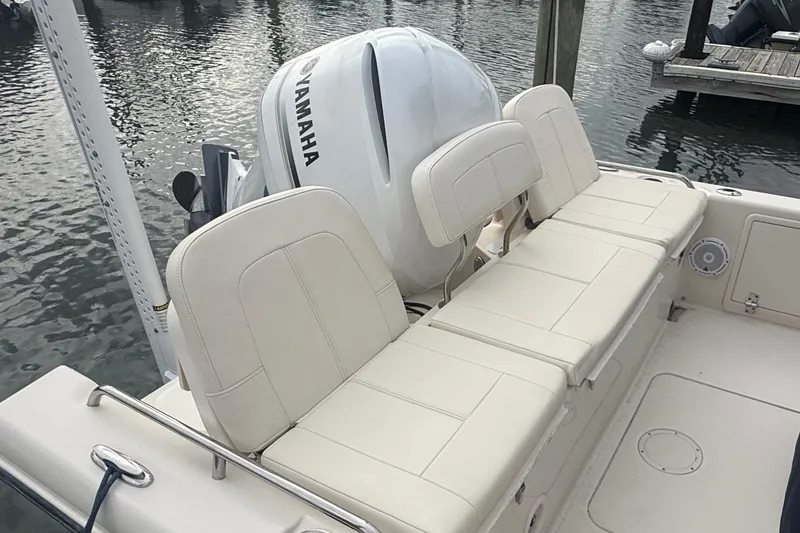 Slide: The Image of 2021 Grady-White 251 Coastal Explorer boat with Yamaha engine, featuring comfortable seating. - 13