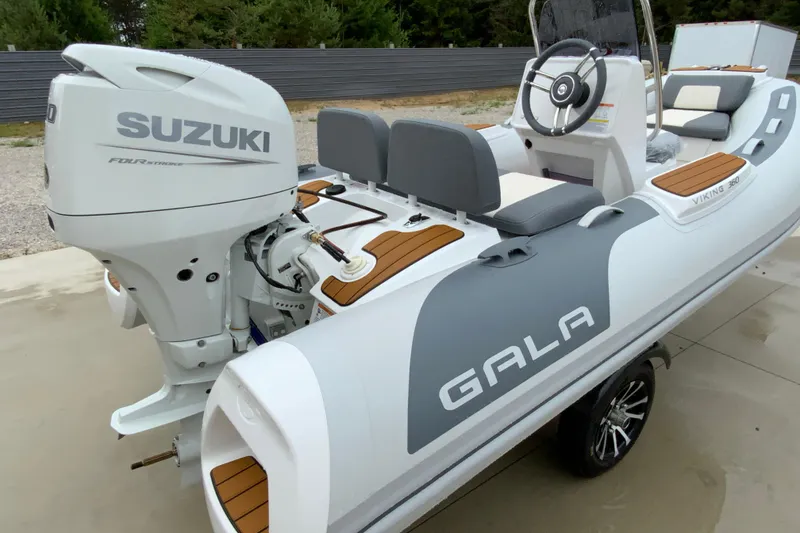 Slide: The Image of Gala V360 inflatable boat with Suzuki engine, 2027 model, featuring sleek design and modern seating. - 8