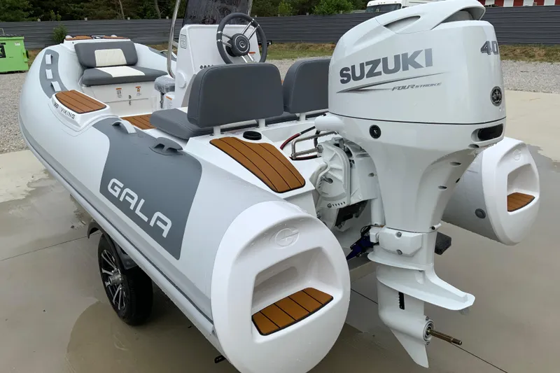 Slide: The Image of 2027 Gala V360 boat with Suzuki 40 horsepower engine, featuring sleek design and comfortable seating. - 10