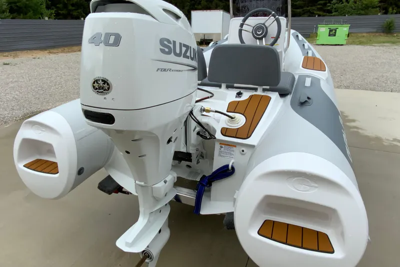 Slide: The Image of Gala V360 boat with Suzuki 40 engine, 2027 model, on concrete surface. - 9