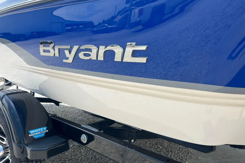 Slide: The Image of Blue and white 2012 Bryant 196 boat with logo on trailer. - 9