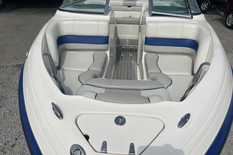 Slide: The Image of 2012 Bryant 196 boat interior with white and blue seating, open bow design. - 5