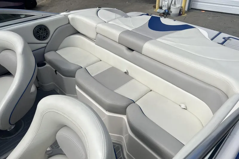 Slide: The Image of Interior of a 2012 Bryant 196 boat with white and gray seating. - 7