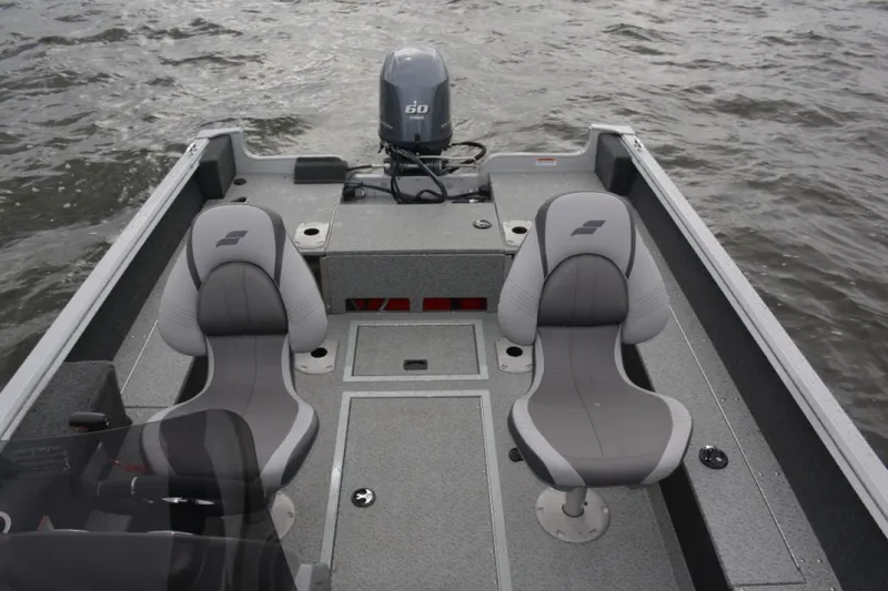 Slide: The Image of Manufacturer Provided Image: 2022 Starcraft Stealth 166 SC boat interior with two seats and outboard motor. - 10