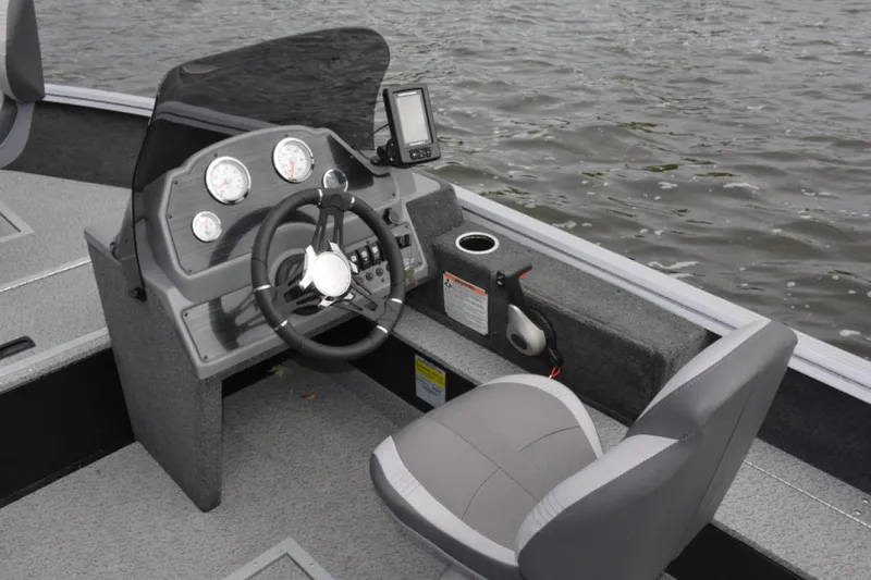 Slide: The Image of Manufacturer Provided Image: 2022 Starcraft Stealth 166 SC boat console with steering wheel and navigation system. - 9
