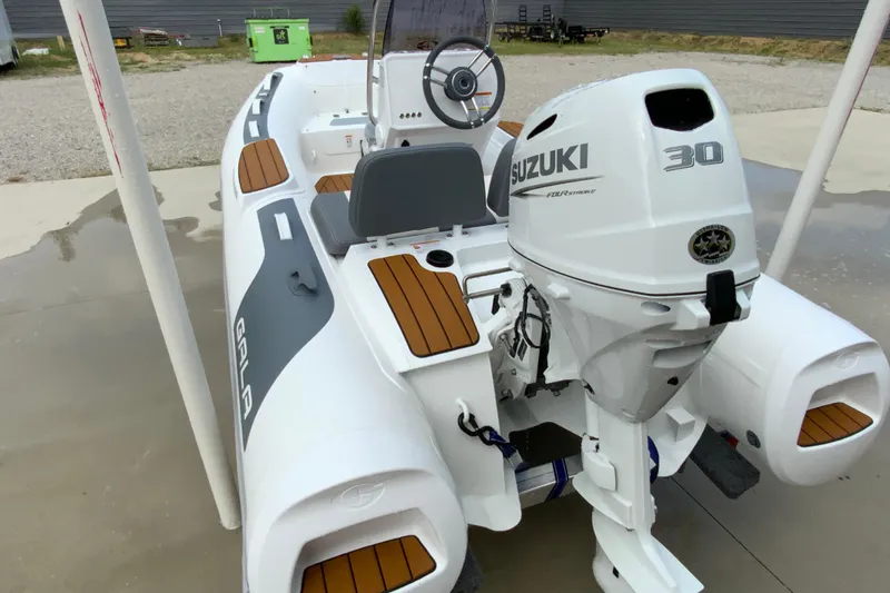 Slide: The Image of 2027 Gala V330 boat with Suzuki 30 horsepower engine, featuring sleek design and modern amenities. - 8