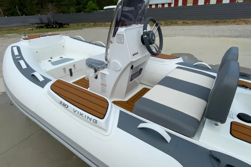 The Image of 2027 Gala V330 Viking boat with sleek design and modern seating. - 1