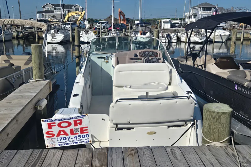 Slide: The Image of 1997 Carver 260 Mid Cabin Express boat for sale at marina dock. - 5