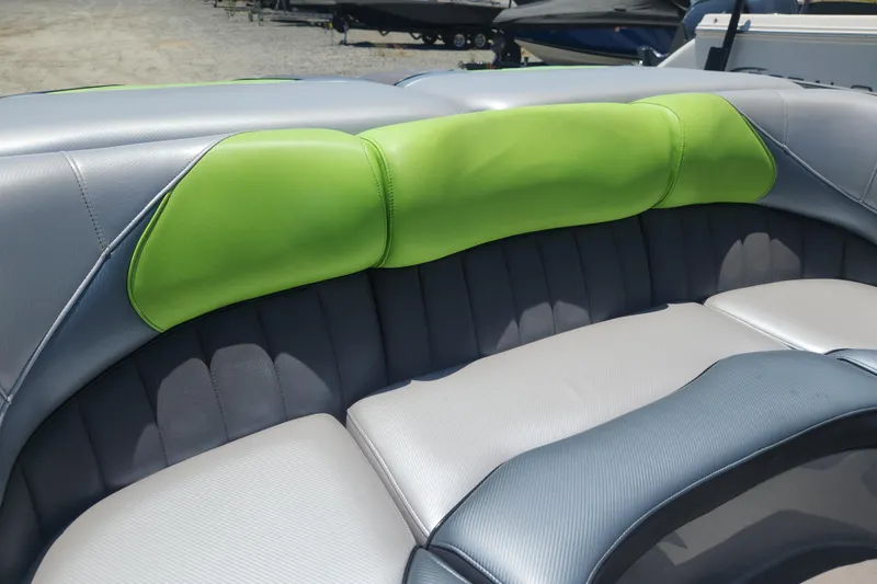 Slide: The Image of 2015 MB SPORTS F22 Tomcat boat interior with gray and green seating. - 5