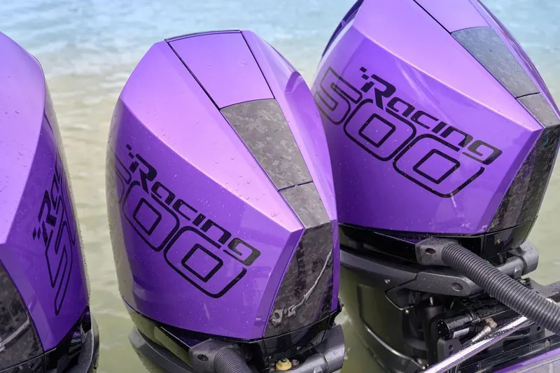 Slide: The Image of Manufacturer Provided Image: Purple Racing 500 outboard motors on Statement 380 Open, 2026 model, near water. - 6