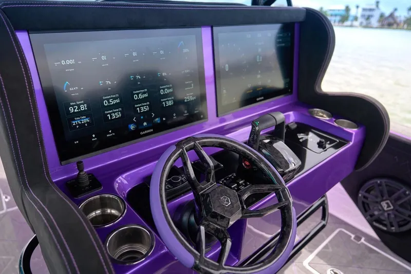 Slide: The Image of Manufacturer Provided Image: Purple dashboard of 2026 Statement 380 Open boat with dual screens and steering wheel. - 3