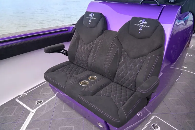 Slide: The Image of Manufacturer Provided Image: Luxurious seating on 2026 Statement 380 Open boat, featuring purple accents and cup holders. - 4