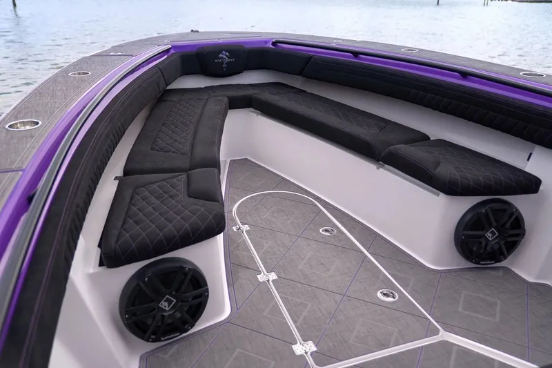 Slide: The Image of Manufacturer Provided Image: Luxurious interior of 2026 Statement 380 Open boat with black seating and purple accents. - 2