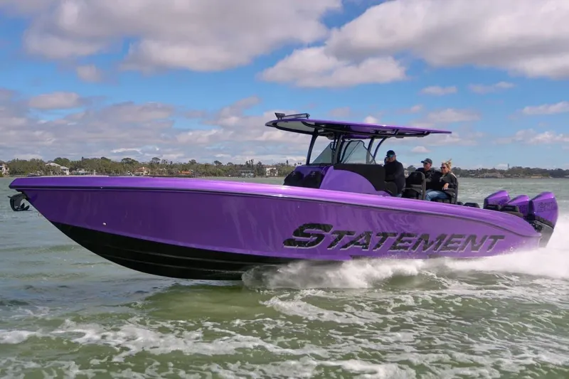 The Image of Manufacturer Provided Image: Purple 2026 Statement 380 Open boat cruising on water under a partly cloudy sky. - 0