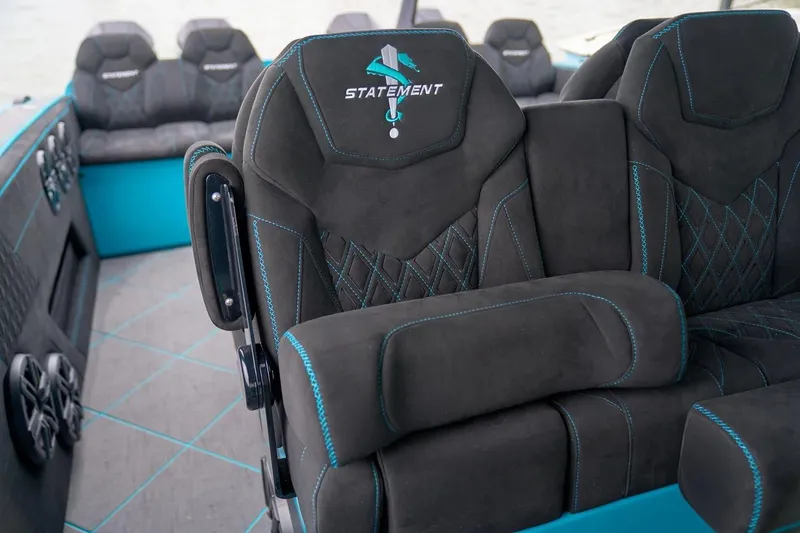 Slide: The Image of Manufacturer Provided Image: Luxury seating in 2025 Statement 430 Tigress boat with sleek design and blue accents. - 5
