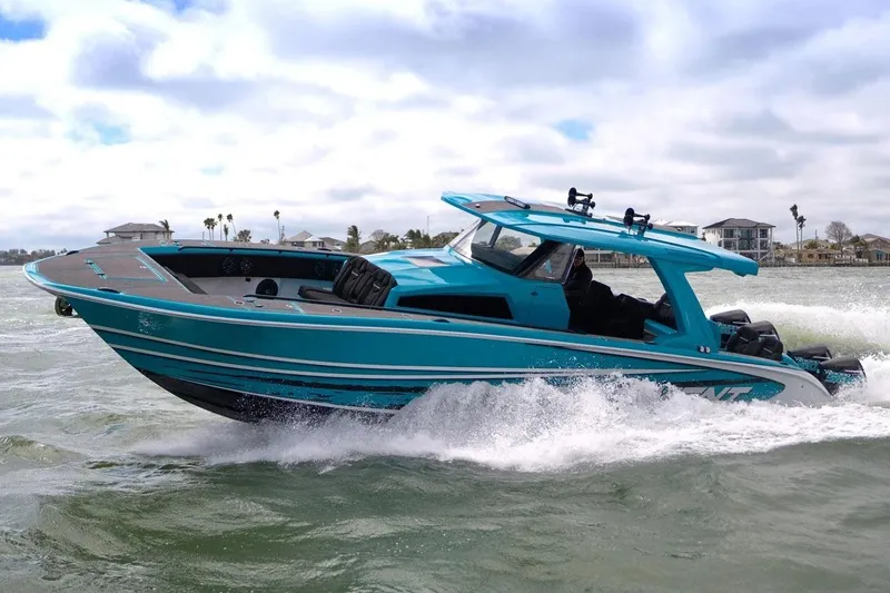 The Image of Manufacturer Provided Image: 2025 Statement 430 Tigress boat cruising on water, showcasing sleek design and vibrant blue color. - 0