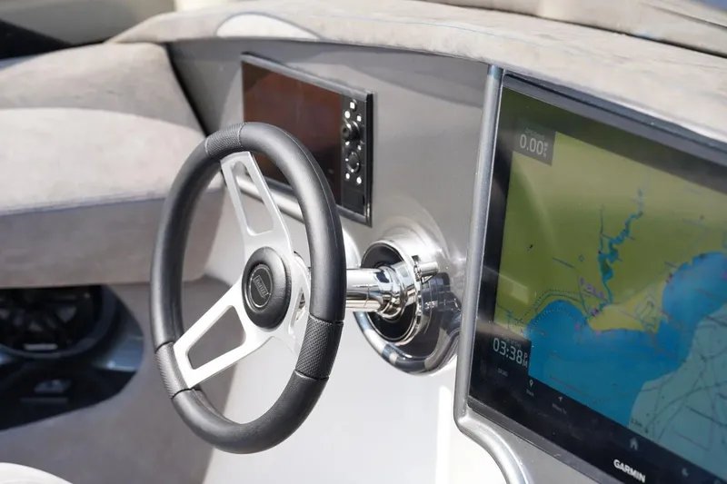 Slide: The Image of Manufacturer Provided Image: Steering wheel and navigation display of 2026 Statement 360 CAT boat. - 8