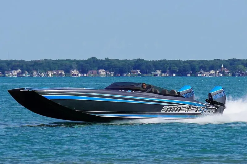 Slide: The Image of Manufacturer Provided Image: High-speed Statement 360 CAT boat cruising on a lake, 2026 model, with twin Racing 500 engines. - 4