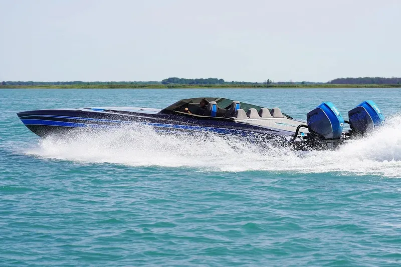 Slide: The Image of Manufacturer Provided Image: 2026 Statement 360 CAT speedboat cruising on open water with dual outboard engines. - 3