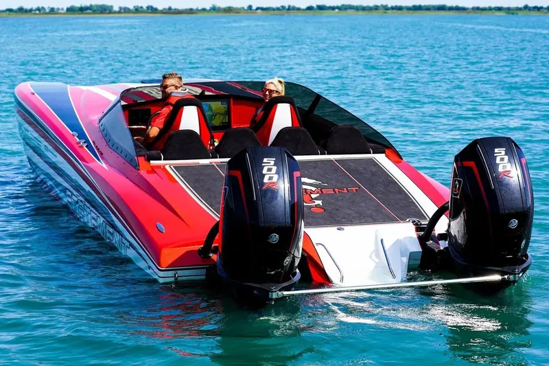 Slide: The Image of Manufacturer Provided Image: Red Statement 360 CAT boat with dual 500R engines on blue water. - 2