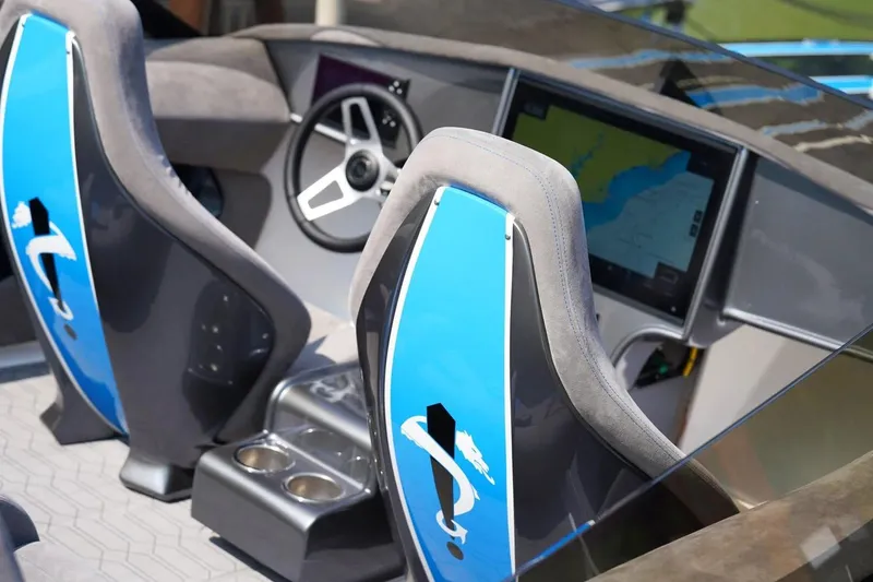 Slide: The Image of Manufacturer Provided Image: Interior of 2026 Statement 360 CAT boat with modern dashboard and blue-accented seats. - 6