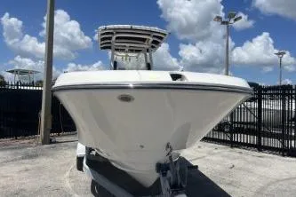 Slide: The Image of 2023 Trophy T24 CC boat displayed outdoors under a clear blue sky. - 3