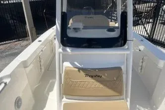 Slide: The Image of 2023 Trophy T24 CC boat interior with console and seating, showcasing modern design. - 10