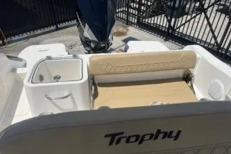 Slide: The Image of 2023 Trophy T24 CC boat interior with seating and storage, featuring a sleek design. - 11