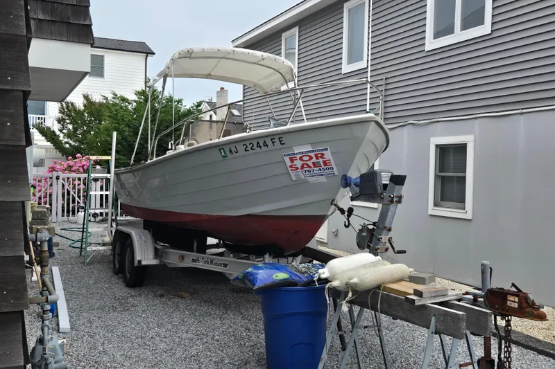 Slide: The Image of 1974 Chris-Craft 22 Tournament Fisherman boat for sale on trailer in residential area. - 6
