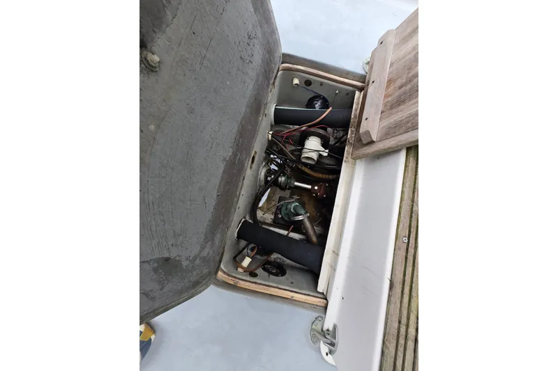 Slide: The Image of 1974 Chris-Craft 22 Tournament Fisherman engine compartment with visible wiring and components. - 12