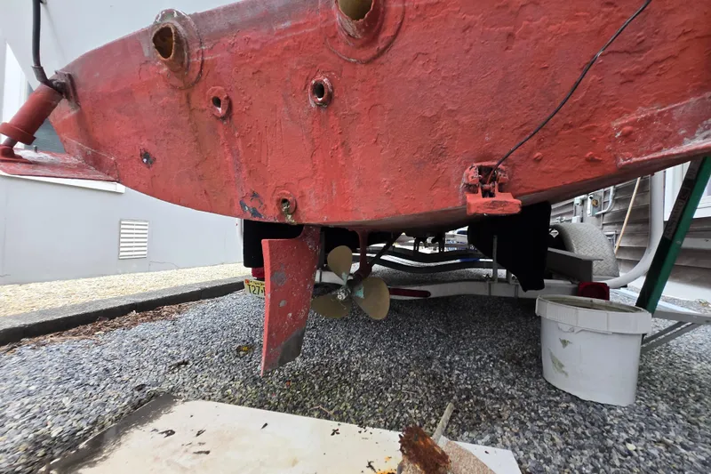 Slide: The Image of 1974 Chris-Craft 22 Tournament Fisherman boat hull and propeller on trailer. - 23
