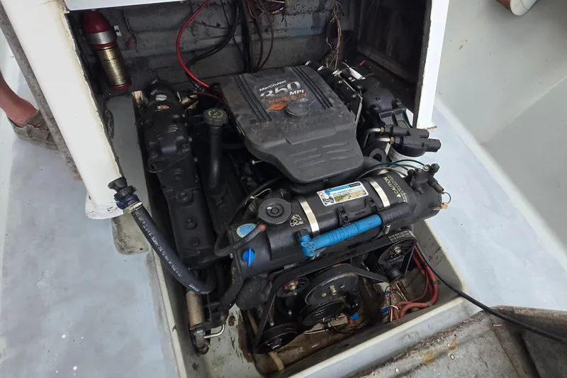 Slide: The Image of 1974 Chris-Craft 22 Tournament Fisherman engine compartment with MerCruiser 260 MPI engine. - 2