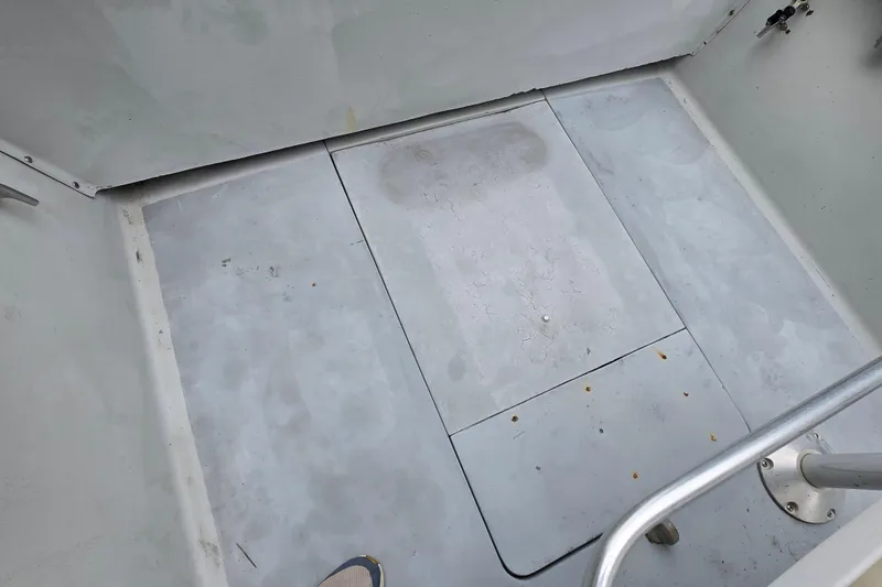 Slide: The Image of 1974 Chris-Craft 22 Tournament Fisherman boat deck, showing clean, spacious interior layout. - 19