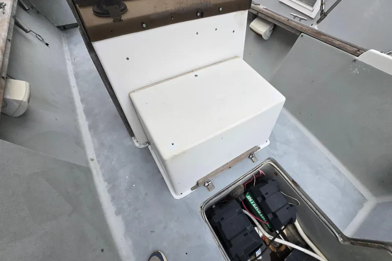 Slide: The Image of 1974 Chris-Craft 22 Tournament Fisherman boat interior with battery compartment and seating. - 8