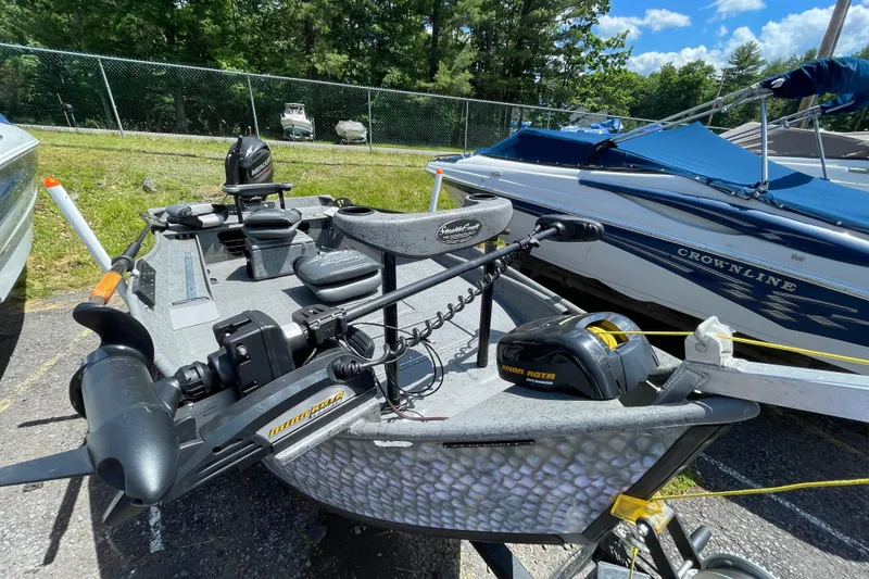 Slide: The Image of 2018 StealthCraft 16 Power Drifter boat with Minn Kota motor in outdoor setting. - 2