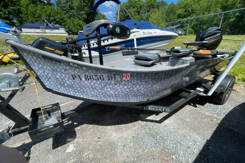 The Image of 2018 StealthCraft 16 Power Drifter boat on trailer, parked outdoors in sunny setting. - 0