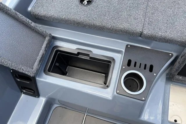 Slide: The Image of Interior view of 2025 Falcon Boats F-18, featuring storage compartment and cup holder. - 4