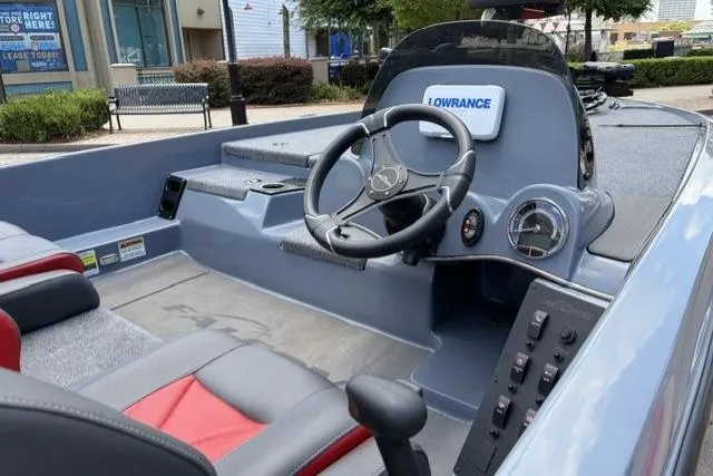 Slide: The Image of 2025 Falcon Boats F-18 cockpit with steering wheel and Lowrance electronics. - 11