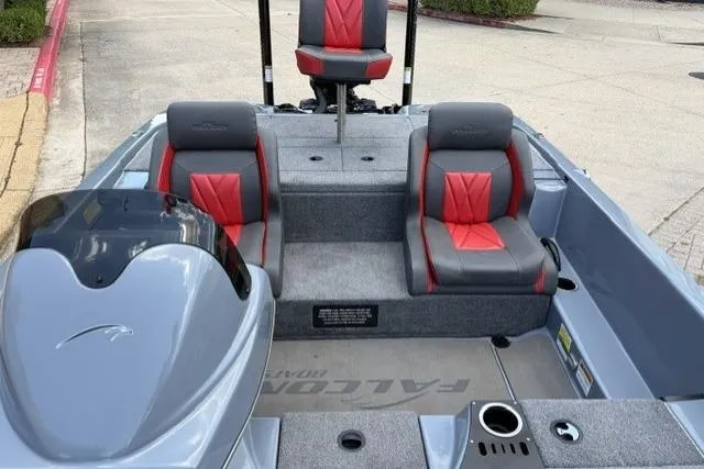 The Image of 2025 Falcon Boats F-18 interior with gray and red seating, modern design. - 1