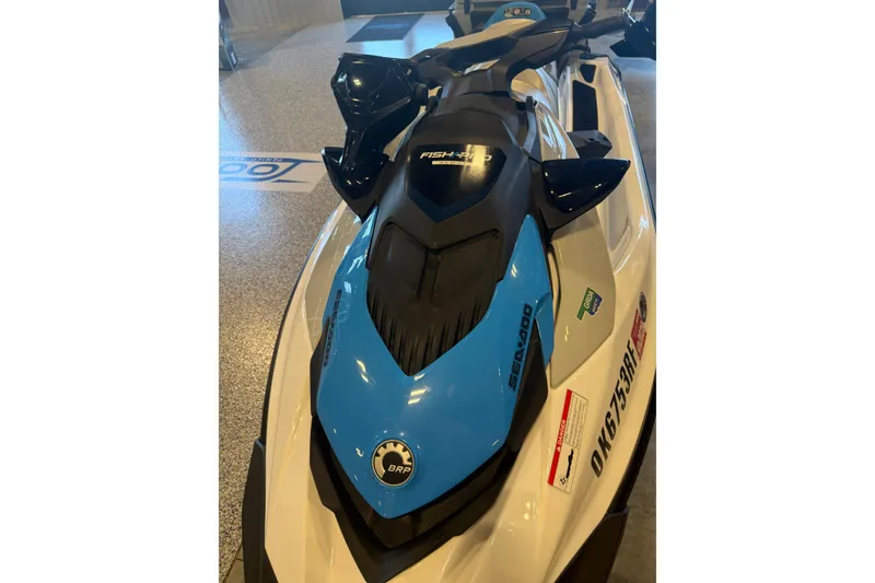 Slide: The Image of 2022 Seadoo FishPro jet ski in showroom, featuring sleek design and blue accents. - 6