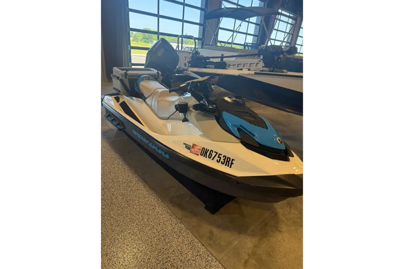 The Image of 2022 Seadoo FishPro jet ski displayed indoors, featuring a sleek design and fishing equipment. - 1