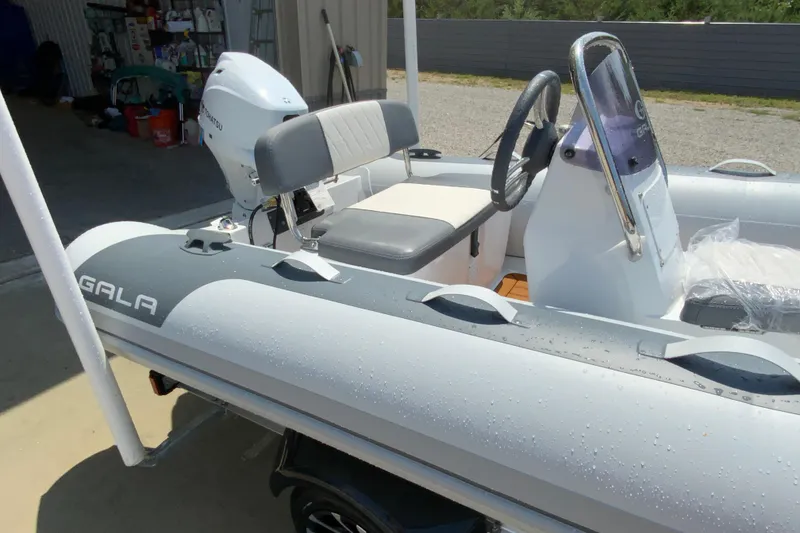 Slide: The Image of Inflatable boat Gala A330L 2027 model with steering console and outboard motor. - 6