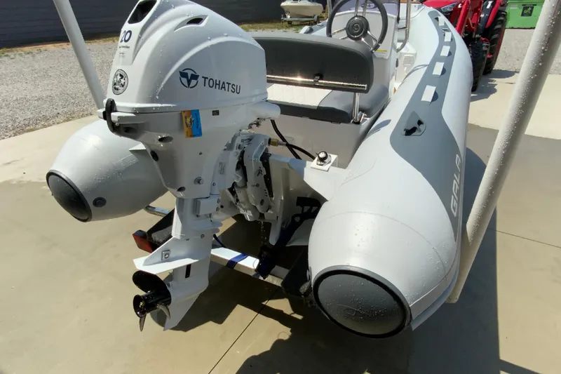 Slide: The Image of Inflatable boat Gala A330L 2027 with Tohatsu outboard motor on a sunny day. - 7