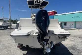 Slide: The Image of 2022 Trophy T20 boat with powerful outboard motor, parked outdoors on a sunny day. - 6