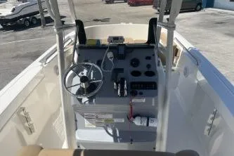 Slide: The Image of 2022 Trophy T20 boat dashboard with steering wheel and controls. - 8