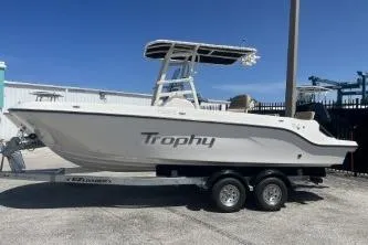 Slide: The Image of 2022 Trophy T20 boat on trailer, side view, under clear blue sky. - 5